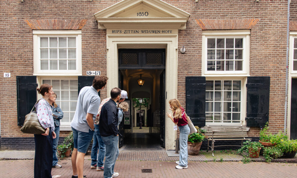People on a city trip in Amsterdam. Visitors outside a museum.