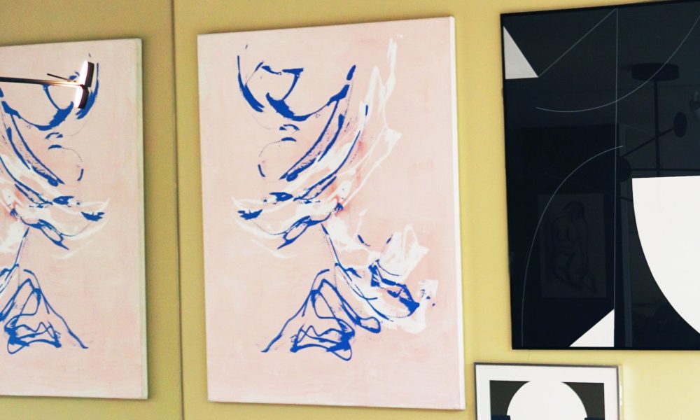 Modern art paintings on display. Abstract art in a room.